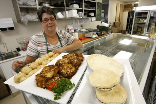MIKE.DEAL@FREEPRESS.MB.CA 090826 Restaurant review - Desserts Plus Barbara Reiss in her store Desserts Plus on Corydon Ave. with (l-r) knishes, potato latkes and chicken pot pie. WINNIPEG FREE PRESS