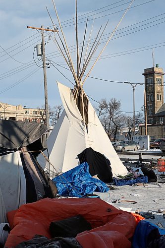 SHANNON VANRAES / WINNIPEG FREE PRESS
A teepee erected in honour of Matthew Allan Sutherland, who was murdered earlier this year, now serves as a warm shelter for homeless people living in a makeshift camp near the Manitoba Metis Federation building in downtown Winnipeg. A group of people were asleep inside the teepee over the lunch hour on December 23, 2019.