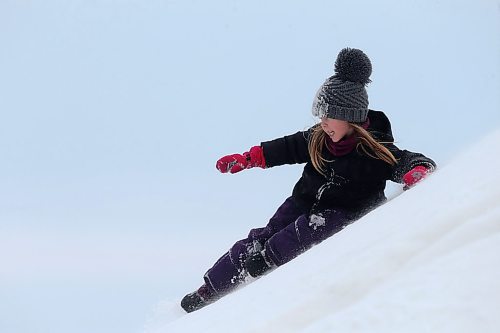 SHANNON VANRAES / WINNIPEG FREE PRESS
Carmen Burron, 5, slides down Snow Mountain at A Maze in Corn near St. Adolphe on January 3, 2020.

