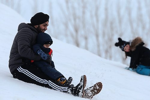 SHANNON VANRAES / WINNIPEG FREE PRESS
Jaskaran Singh and his nephew Avraj slide down snow mountain at A Maze in Corn near St. Adolphe on January 3, 2020.


