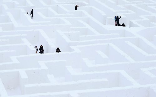 SHANNON VANRAES / WINNIPEG FREE PRESS
Visitors wind their way though a giant snow maze, stopping along the way to take selfies, on January 3, 2020. The maze is located near St. Adolphe and is considered the largest of its kind in the world.

