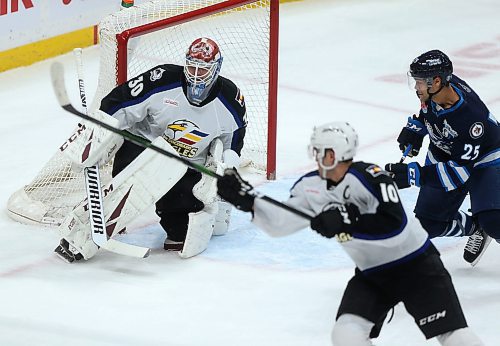 SHANNON VANRAES / WINNIPEG FREE PRESS
Mark Alt of the Colorado Eagles prepares to deflect a shot on goalie Adam Werner as C.J. Suess of the Manitoba Moose moves in during a game at the MTS Centre in Winnipeg on January 3, 2020.


