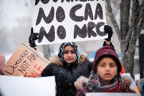 Daniel Crump / Winnipeg Free Press. Naheen Khaleeli holds a sign during a demonstration against India's Citizenship Amendment Act and National Registration of Citizens laws. The rally which attracted several dozens of people was held outside the Canadian Museum For Human Rights Saturday afternoon. 4January 4, 2020.