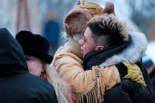 Daniel Crump / Winnipeg Free Press. Winston Wakita hugs Kelly Frasers sister during a vigil in memory of Kelly. Hundreds of People attended the ceremony at the Odena Circle at The Forks. January 4, 2020.