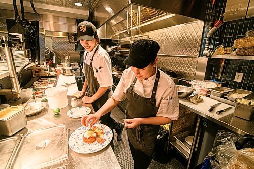 Mike Sudoma / Winnipeg Free Press
Line Cooks, Tiffany Church (right) and Mac Braun (left) prepare a Smoked Salmon and Rosti dish at Pauline Restaurant inside the Norwood Hotel in St Vital Tuesday morning.
January 7, 2020
