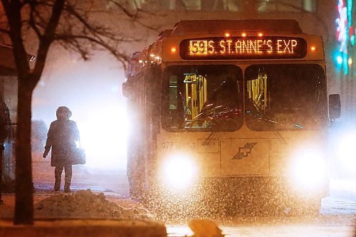 JOHN WOODS / WINNIPEG FREE PRESS
A person waits for a bus on Portage Avenue during a snowfall in Winnipeg Wednesday, January 8, 2020. 

Reporter: standup