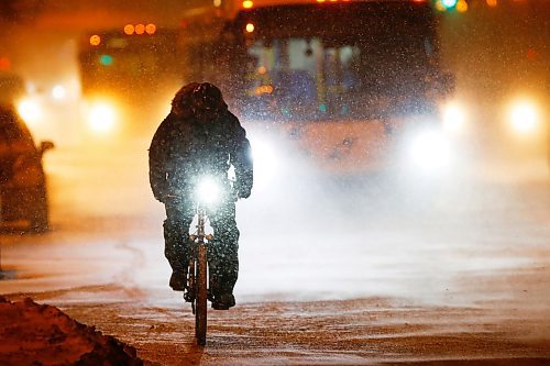JOHN WOODS / WINNIPEG FREE PRESS
A cyclist makes their way down Portage Avenue during a snowfall in Winnipeg Wednesday, January 8, 2020. 

Reporter: standup