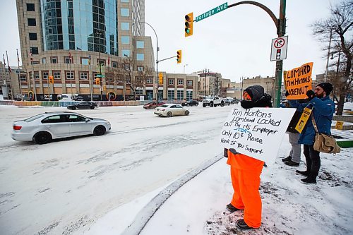 MIKE DEAL / WINNIPEG FREE PRESS
Locked out Tim Horton's employees as well as supporters demonstrate at Portage and Main Thursday, just outside of 1 Lombard Place where the coffee shop is located in the underground shopping centre.
200109 - Thursday, January 09, 2020.