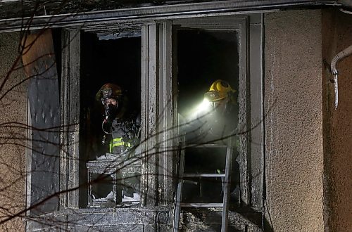 SHANNON VANRAES / WINNIPEG FREE PRESS
Members of the Winnipeg Fire Paramedic Service work to extinguish hotspots after a fire gutted a house at 346 Maryland St. on January 9, 2020.