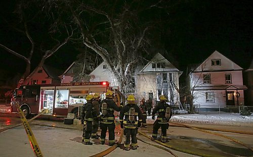 SHANNON VANRAES / WINNIPEG FREE PRESS
Members of the Winnipeg Fire Paramedic Service work to extinguish hotspots after a fire gutted a house at 346 Maryland St. on January 9, 2020.