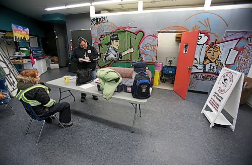 SHANNON VANRAES / WINNIPEG FREE PRESS
Travis Bighetty, co-founder of the West Broadway Bear Clan Patrol, and Rebecca Ford wait for volunteers to arrive for a Friday night patrol at the organization's "den" inside the Broadway Neighbourhood Centre.