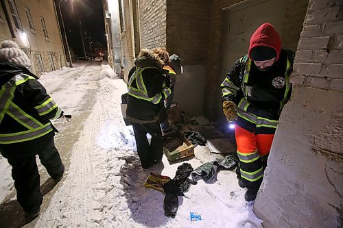 SHANNON VANRAES / WINNIPEG FREE PRESS
Despite frostbite warnings and extreme cold, members of the West Broadway Bear Clan Patrol walk the back lane of Furby St. on January 10, 2020. Volunteers search debris for sharps, like needles, and other hazardous item that could cause injury.