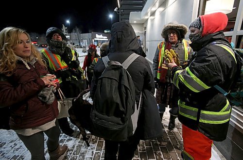 SHANNON VANRAES / WINNIPEG FREE PRESS
Volunteers with the West Broadway Bear Clan Patrol hand out snacks and hot soup outside a McDonald's restaurant on Sherbrook Street on January 10, 2020. Temperatures dipped into the -30s that night.
