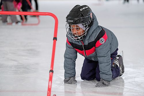 Daniel Crump / Winnipeg Free Press. Adonay Takeia sits on his hands and knees after taking a tumble on the ice. This was Takeias first time skating. January 11, 2020.