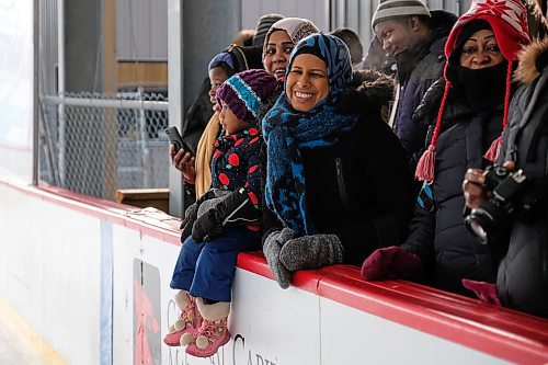 Daniel Crump / Winnipeg Free Press. Zebiba Ibrahim (blue scarf) watches kids skate for the first time during the True North Youth Foundations Welcome to Winnipeg event at Camp Manitou. January 11, 2020.