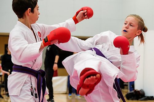 Daniel Crump / Winnipeg Free Press. Dominic Beyak (right) aims a kick at Noah Farrell (left) during a karate demonstration at Sport Manitoba's Game day. The open house style event allows kids to try out many different sports. January 11, 2020.