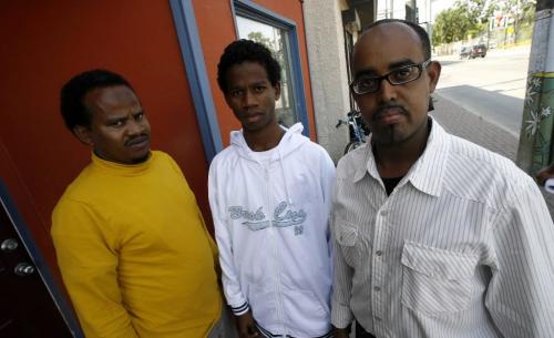 MIKE.DEAL@FREEPRESS.MB.CA 090903 (l-r) Mahamed Osman the assistant coach of the soccer team, Mahamed Osman is a player for the Winnipeg Somali Soccer Club and Abdi Muuse is the president of the Winnipegt Somali Confederation Union, outside their office on Ellice Ave. See Carol Sanders story WINNIPEG FREE PRESS