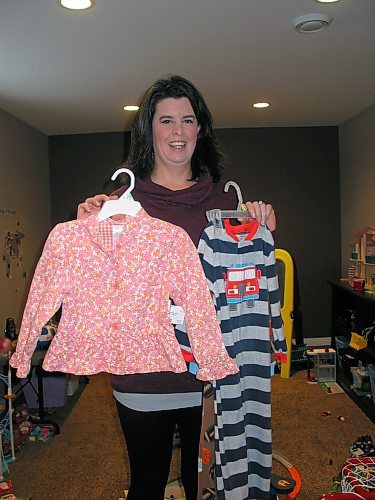 Canstar Community News Jan. 6, 2020 - Chelsea Clapham, of Headingley, displays children's clothing that are part of Childcycle's inventory. Consigned items are sold through Childcycle's online store or at pop-up sales held annually at Glenwood Community Centre and Gateway Recreation Centre in Winnipeg. (ANDREA GEARY/CANSTAR COMMUNITY NEWS)