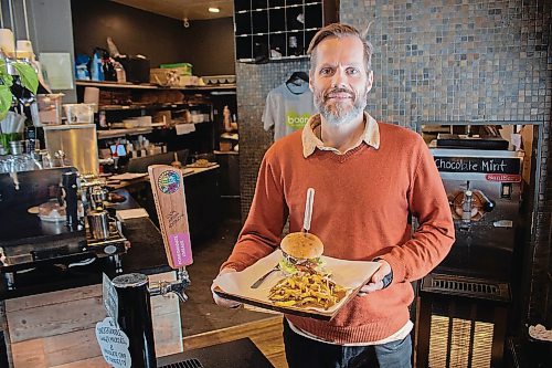 Canstar Community News Jan. 7, 2020 - Thomas Sohlberg, owner of Boon Burger, holding up some food. Boon Burger Winnipeg is set to close its doors on Jan. 19, 2020. (JUSTIN LUSCHINSKI/CANSTAR COMMUNITY NEWS/METRO)
