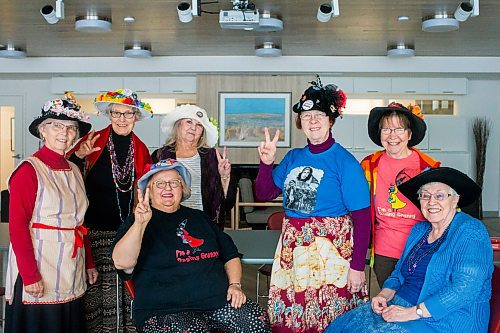 MIKAELA MACKENZIE / WINNIPEG FREE PRESS

The Raging Grannies Adina Lyon (standing left-right), Christa Froese, Shirley Miles, Lois Masur, Debby Lake, Leube Franko (seated left-right), and Helen Smiley pose for a group portrait before a meeting at the Old Grace Housing Co-op in Winnipeg on Monday, Jan. 13, 2020. For Brenda Suderman story.
Winnipeg Free Press 2019.