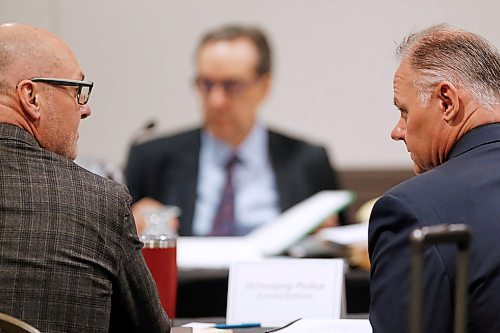 JOHN WOODS / WINNIPEG FREE PRESS
Winnipeg Police Association (WPA) president Moe Sabourin, right, and WPA lawyer Keith LaBossiere talk before arbitrator Michael Werier at a police pension hearing at Winnipegs convention centre Monday, January 14, 2020. The police union is challenging changes to the pension plan with a grievance hearing before an independent labour arbitrator.

Reporter: Kevin Rollason