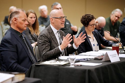 JOHN WOODS / WINNIPEG FREE PRESS
Winnipeg Police Association president Moe Sabourin, left, listens in as their lawyer Keith LaBossiere presents his case on police pensions to arbitrator Michael Werier at a police pension hearing at Winnipegs convention centre Monday, January 14, 2020. The police union is challenging changes to the pension plan with a grievance hearing before an independent labour arbitrator.

Reporter: Kevin Rollason