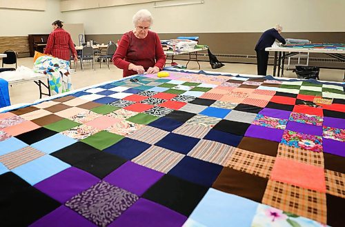 RUTH BONNEVILLE  /  WINNIPEG FREE PRESS 

FAITH - MCC quilting Circle at Springstein Mennonite Church, 

Photos of Women from Springstein Mennonite Church making quilts for Mennonite Central Committee in advance of their 100th year celebration and drive to make and collect 6,500 blankets in one day which takes place on Saturday, January 18th. 

Photo of  Hilda Wiebe (in her 80's), ironing the back panel before it's pinned to the front quilt on Wednesday.  

Reporter: Brenda Suderman,

Jan 15th,  2020