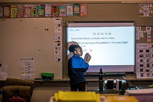 MIKAELA MACKENZIE / WINNIPEG FREE PRESS

Penina Bahati writes on the board in a grade 2/3 math class at Victoria Albert School in Winnipeg on Wednesday, Jan. 15, 2020. For Sol Israel story.
Winnipeg Free Press 2019.