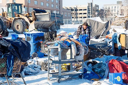 MIKE DEAL / WINNIPEG FREE PRESS
Kyle who has been at the homeless camp for several months starts to move some of his belongings to a friends tent so that the city can start cleaning up the site Thursday morning. The people living in the camps have have been asked to move by the City of Winnipeg for safety reasons.
200116 - Thursday, January 16, 2020.