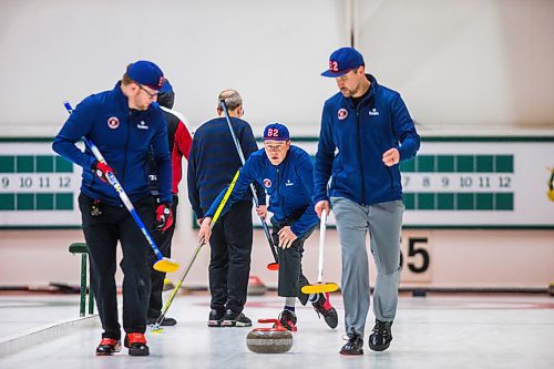 MIKAELA MACKENZIE / WINNIPEG FREE PRESS

Virginia curling team member Travis Hamilton throws a rock as Sam Sparks (left) and Austin Shawinsky sweep in the MB Open at Fort Rouge Curling Club in Winnipeg on Friday, Jan. 17, 2020. For Taylor Allen story.
Winnipeg Free Press 2019.