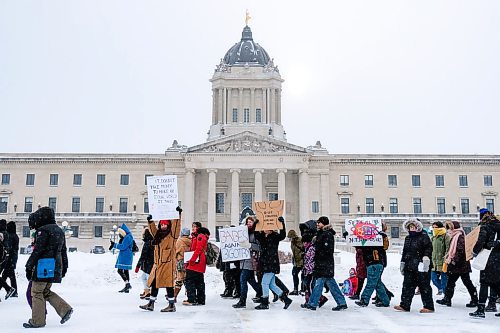 Daniel Crump / Winnipeg Free Press. People hold signs and march during the 2020 Womens March at the Manitoba Legislature. This years march is focused on the right to decide on one's own body. January 18, 2020.