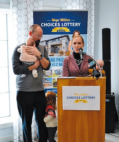 Canstar Community News At a press conference to launch the St. Boniface Hospital Foundation's Mega Million Choices Lottery, Brant (at left, holding baby Emma with two-year-old daughter Carolyn playing shy beside him) and Janelle Batters (holding baby Frederick) spoke glowingly of the care and support their twins received in the neo-natal intensive care unit at St. Boniface Hospital after being born three months early last year.