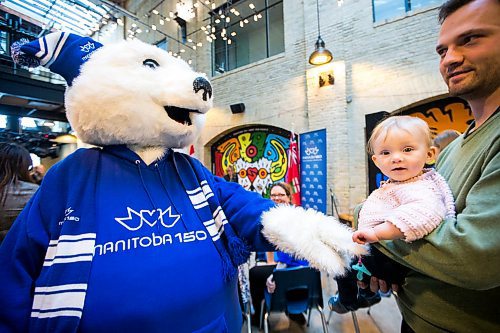 MIKAELA MACKENZIE / WINNIPEG FREE PRESS

Toba, the Manitoba 150 mascot, says hi to Klara Morgenstern (10 months) and her dad, Kevin Morgenstern, before the minister of Canadian heritage announces support for the Manitoba 150 Host Committee at The Forks in Winnipeg on Tuesday, Jan. 21, 2020. For Kevin Rollason story.
Winnipeg Free Press 2019.