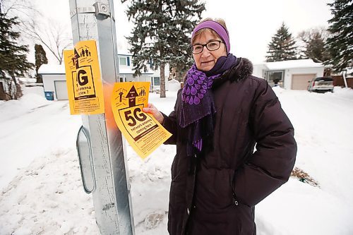 JOHN WOODS / WINNIPEG FREE PRESS
Margaret Friesen, a retired federal biologist, posts an information bulletin about the health dangers related to 5G cell technology to the lamppost in her Winnipeg neighbourhood Wednesday, January 22, 2020. Friesen is the local lead on an international movement opposed the deployment of 5G telecommunications networks because of the uncertainty regarding heath concerns. 5G networks will necessitate the erection of 10s of thousands of small antennae and satellites. Friesen and others believe regulations should require buried fibre optic cables rather than wireless towers.

Reporter: Cash