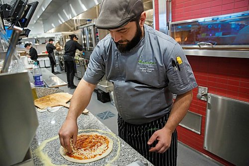 MIKE DEAL / WINNIPEG FREE PRESS
New restaurant in the Seasons of Winnipeg shopping area called Frankie's Italian Kitchen with owners Joe Aiello and his cousin Raffaele Aiello.
Sous Chef Angelo Anania makes a pizza in the kitchen.
200123 - Thursday, January 23, 2020.