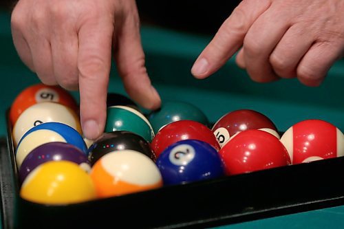 SHANNON VANRAES / WINNIPEG FREE PRESS
Randy Strachan racks pool balls at a billiards night hosted by Adventures for Successful Singles at Flea Whiskey's on January 23, 2020.
