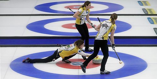 Team Manitoba's skip Mackenzie Zacharias throws a rock as second Emily Zacharias and third Karlee Burgess wait to sweep while playing against Team Alberta during the Canadian Junior Curling Championships in Langley, BC, Sunday, January 26, 2020. (TREVOR HAGAN / WINNIPEG FREE PRESS)