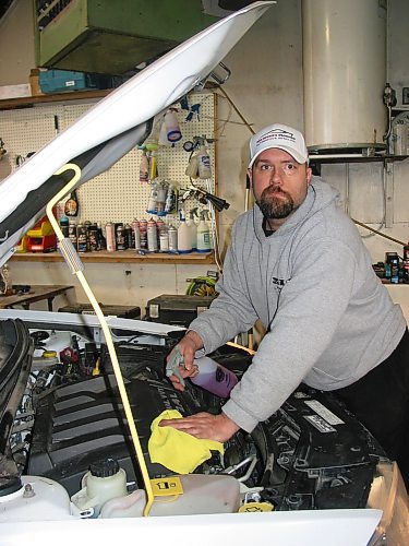 Canstar Community News Jan. 22, 2020 - Nick Hourie is shown cleaning a car's engine at his Portage la Prairie business, Nick Hourie's ProClean Automotive Detailing. (ANDREA GEARY/CANSTAR COMMUNITY NEWS)