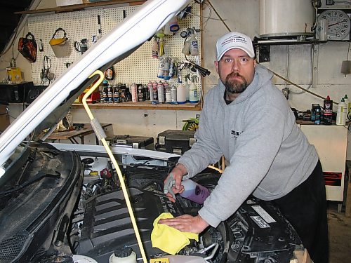 Canstar Community News Jan. 22, 2020 - Nick Hourie is shown cleaning a car's engine at his Portage la Prairie business, Nick Hourie's ProClean Automotive Detailing. (ANDREA GEARY/CANSTAR COMMUNITY NEWS)