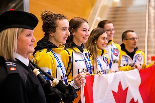 MIKAELA MACKENZIE / WINNIPEG FREE PRESS

Team Manitoba's women's skip Mackenzie Zacharias poses with the team (and piper Hilda Towerzey) at the airport in Winnipeg on Monday, Jan. 27, 2020. For Mike Sawatzky story.
Winnipeg Free Press 2019.