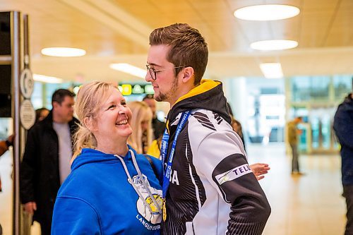 MIKAELA MACKENZIE / WINNIPEG FREE PRESS

Team Manitoba's men's skip Jacques Gauthier hugs his mom, Cathy Gauthier, at the airport in Winnipeg on Monday, Jan. 27, 2020. For Mike Sawatzky story.
Winnipeg Free Press 2019.