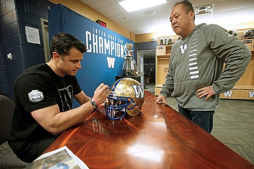 JOHN WOODS / WINNIPEG FREE PRESS
Newly signed Winnipeg Blue Bomber Zach Collaros signs autographs for Jeff Baquiran and fans in the teams locker room in Winnipeg Tuesday, January 28, 2020. Collaros has been signed for two years after being parachuted in to help bring home the Grey Cup for the Bombers last season.

Reporter: ?