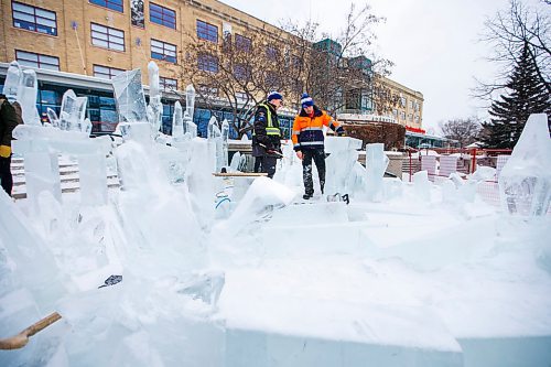 MIKAELA MACKENZIE / WINNIPEG FREE PRESS

Brian McArthur, ice artist (left), and Luca Roncoroni, ice designer, work on the stage for the Glacial performance at The Forks in Winnipeg on Wednesday, Jan. 29, 2020. For Erin Lebar story.
Winnipeg Free Press 2019.