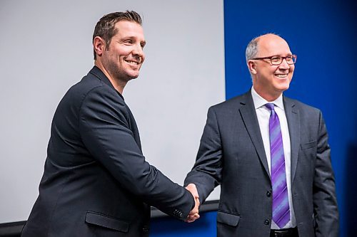 MIKAELA MACKENZIE / WINNIPEG FREE PRESS

Kevin Saurette, upcoming MJHL commissioner (left) and Kim Davis, current MJHL commissioner, shake hands after announcing the leadership change at Sport Manitoba in Winnipeg on Wednesday, Jan. 29, 2020. For Mike Sawatzky story.
Winnipeg Free Press 2019.