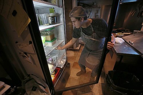 SHANNON VANRAES / WINNIPEG FREE PRESS
Sam Basset grabs ingredients out of a cooler at The Roost Social Club on Wednesday, January 29, 2020. The restaurant features a primarily plant-based menu full of vegan and vegetarian dishes.