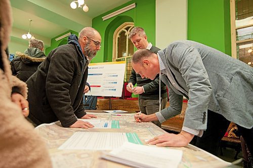 Mike Sudoma / Winnipeg Free Press
Spence St resident, James Plett, talks to Erik Dickson of Urban Systems (top right) and Chris Baker (Bottom Right) as he voices opinions on the proposed Downtown Walk Bike Project during an information session held at the Westminster Church Wednesday evening
January 29, 2020