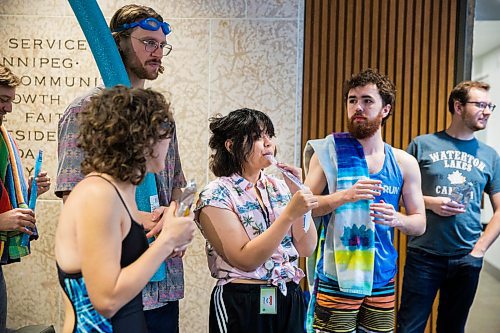 MIKAELA MACKENZIE / WINNIPEG FREE PRESS

Arielle Villarin, Budget for All Winnipeg member, eats a freezie at a "pool party" in the lobby of City Hall in protest of proposed budget cuts to city pools and recreation facilities in Winnipeg on Thursday, Jan. 30, 2020. For Danielle Da Silva story.
Winnipeg Free Press 2019.