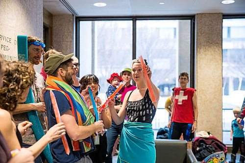 MIKAELA MACKENZIE / WINNIPEG FREE PRESS

Nicole Jowett, Budget for All Winnipeg member, hands out freezies at a "pool party" in the lobby of City Hall in protest of proposed budget cuts to city pools and recreation facilities in Winnipeg on Thursday, Jan. 30, 2020. For Danielle Da Silva story.
Winnipeg Free Press 2019.