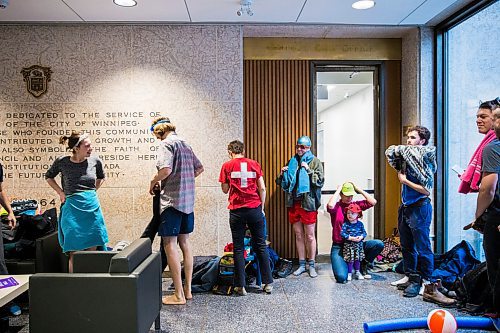 MIKAELA MACKENZIE / WINNIPEG FREE PRESS

Members of Budget for All Winnipeg get changed into beach attire for a "pool party" in the lobby of City Hall in protest of proposed budget cuts to city pools and recreation facilities in Winnipeg on Thursday, Jan. 30, 2020. For Danielle Da Silva story.
Winnipeg Free Press 2019.