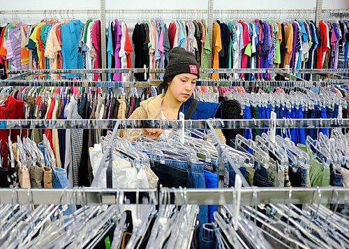 Mike Sudoma / Winnipeg Free Press
Avid thrifter, Taylor Lavallee looks to find some hidden gems burried in the clothing racks of the Goodwill store on Pembina Highway during its first day being back open since last March.
January 30, 2020